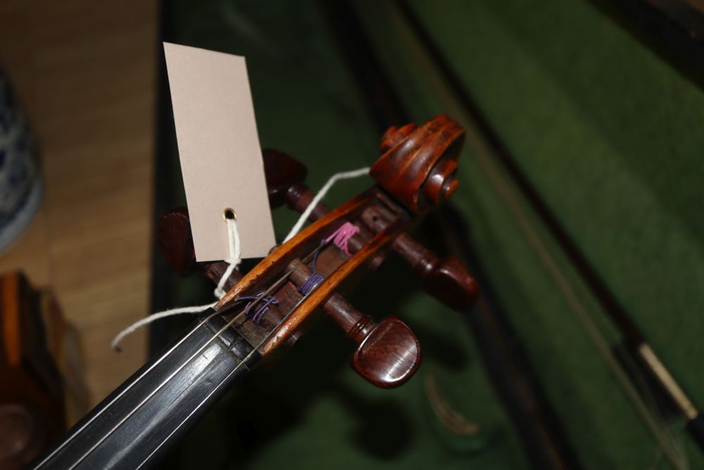 A late 19th century European violin with inlaid decoration, cased with bow, Joseph Guanaris label to interior of violin